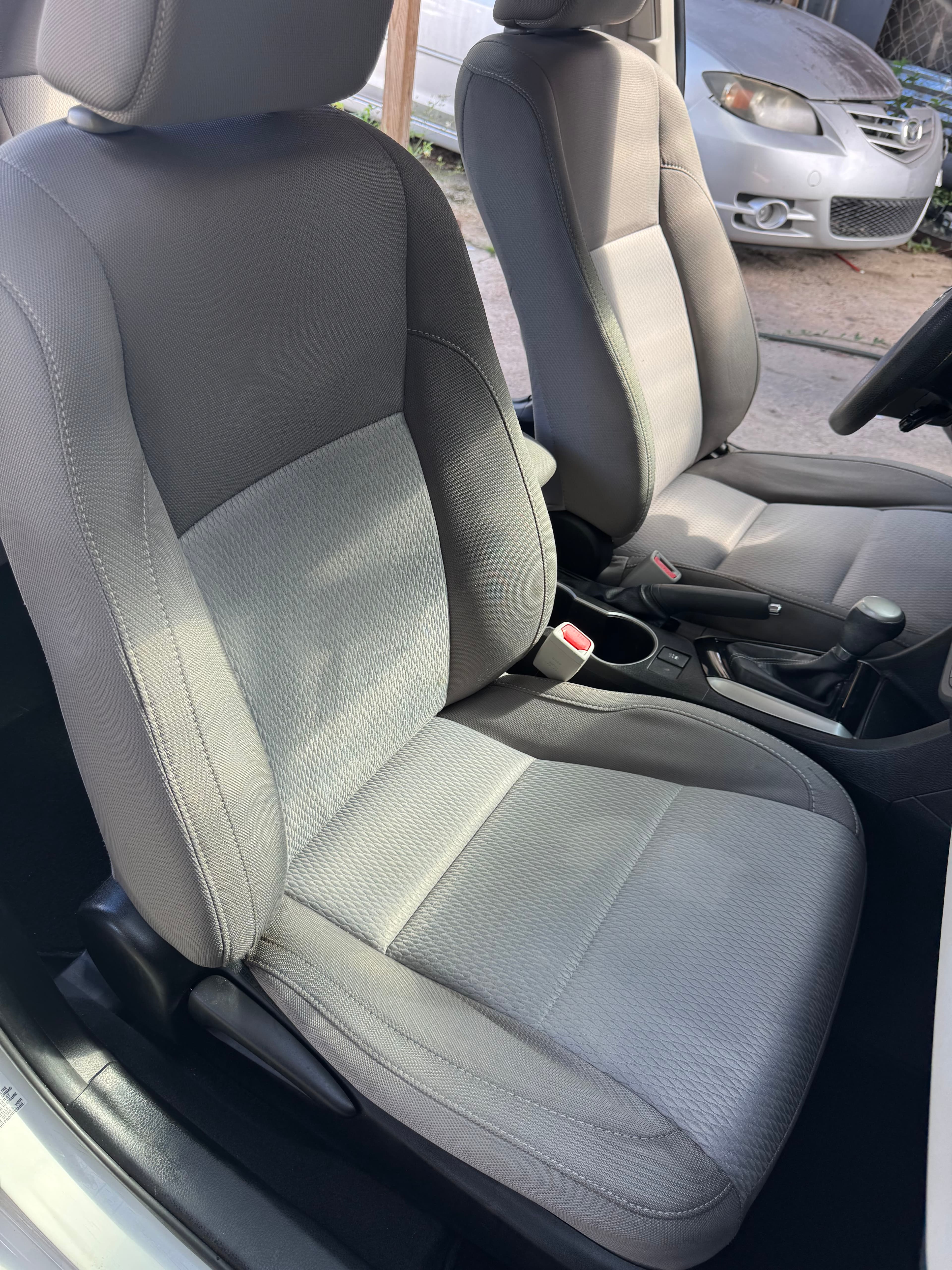 Clean gray cloth front seats after an interior detailing appointment